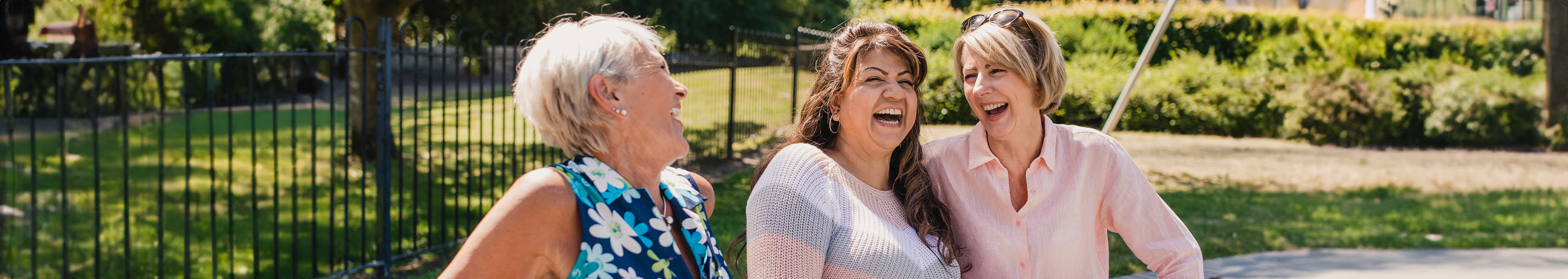 three women park laughing