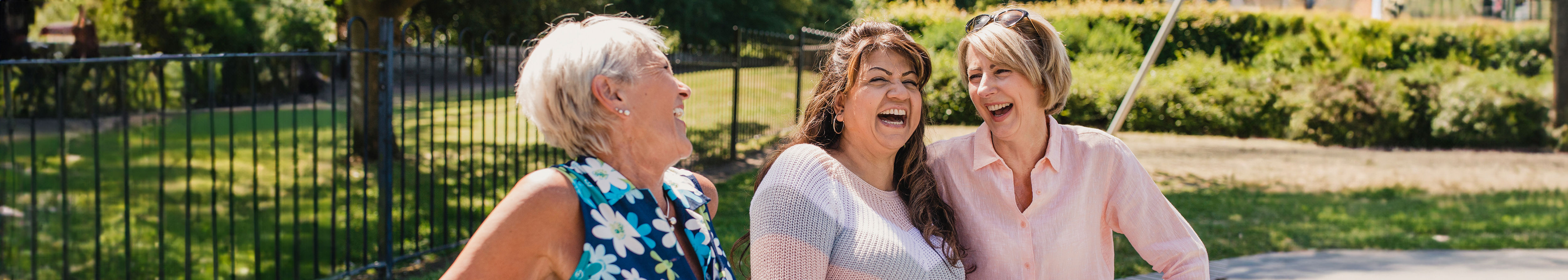 three women park laughing