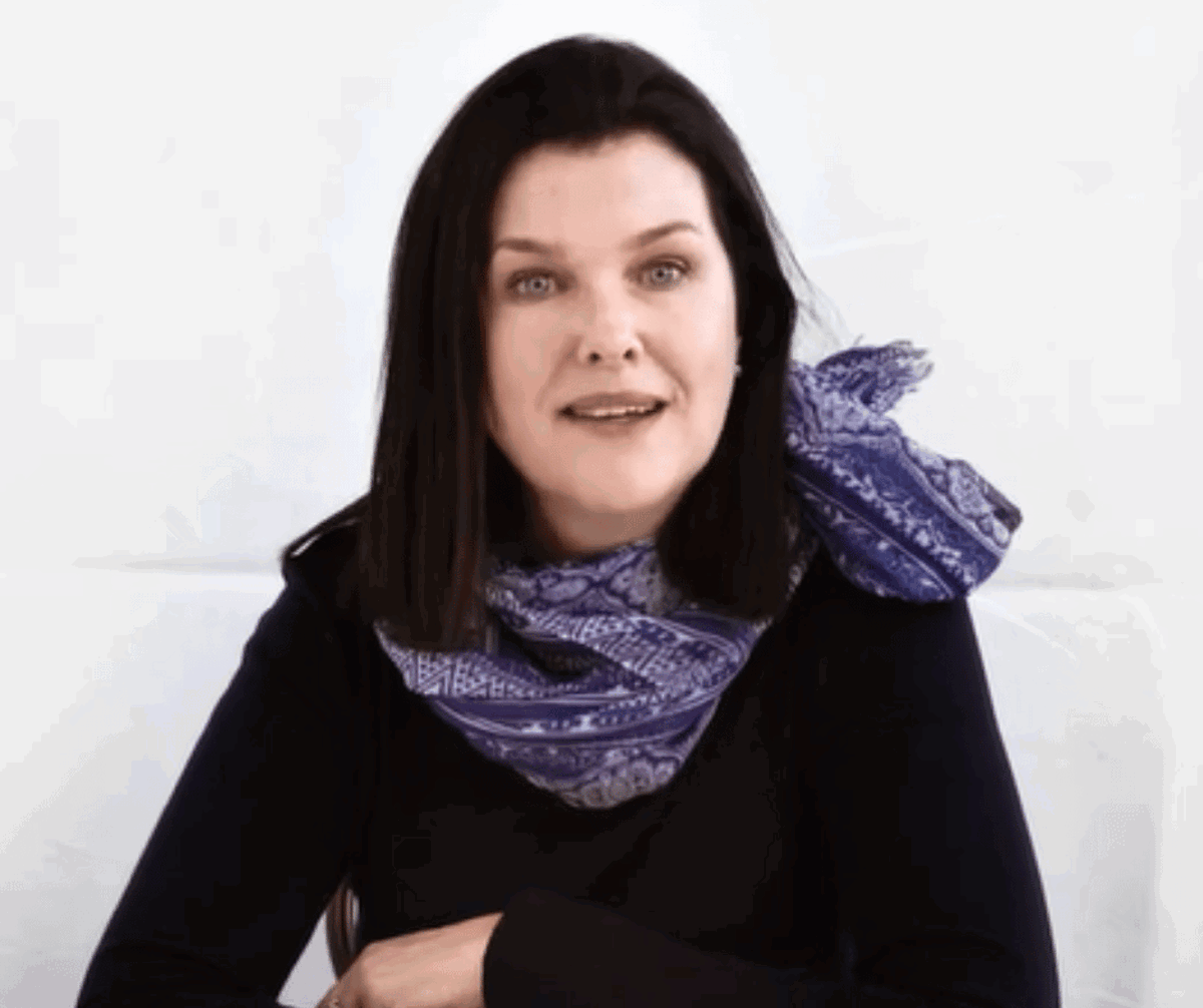 Client testimonial of Regina who is smiling 